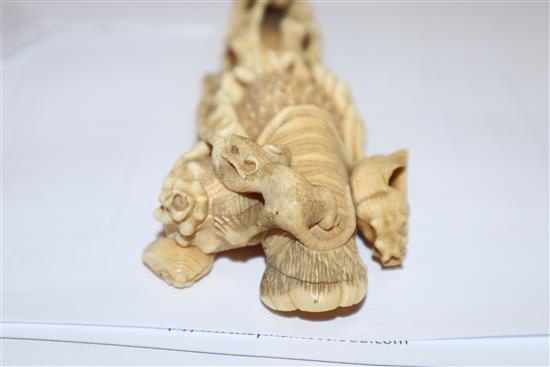 A Japanese ivory okimono of rats crawling over a lobster, early 20th century, unsigned 14.5cm